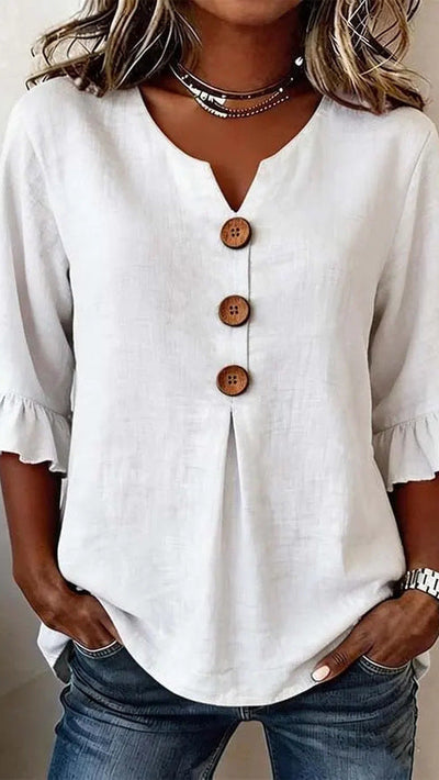 Carla |Blusa con botones y volantes.